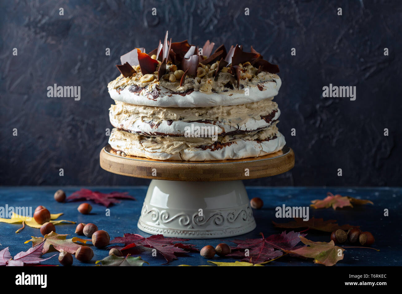 Hazelnut meringue cake with coffee cream and chocolate Stock Photo Alamy