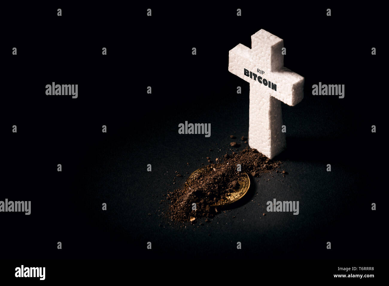 white grave cross and bitcoin sprinkled with earth. The concept of the fall  of the cost of bitcoin and its death as the most expensive crypto currency  Stock Photo - Alamy