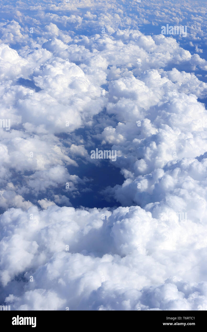 Natual sky background with white clouds, view from the airplane Stock Photo