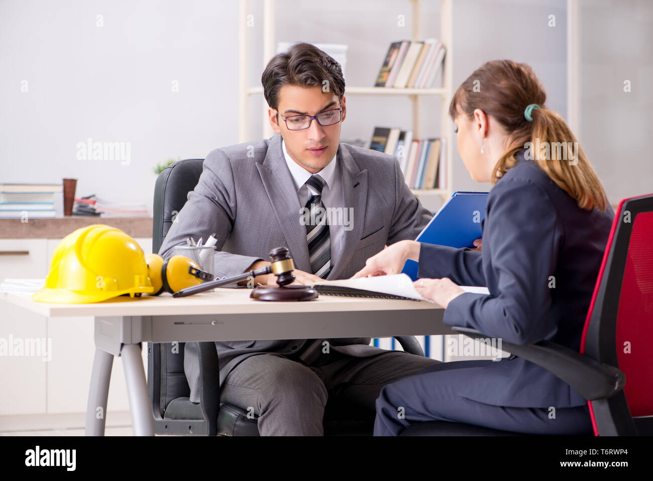 Lawyer Talking To Client In Office Stock Photo - Alamy