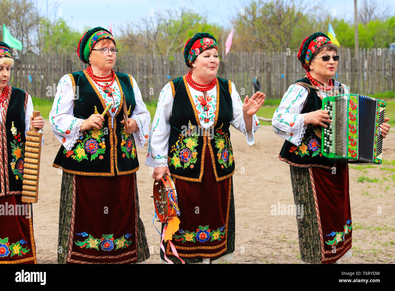 Petrikovka, Dnepropetrovsk region, Ukraine, 28 04 2019. Elderly women in national Ukrainian costumes play folk instruments and sing at the festival. Stock Photo