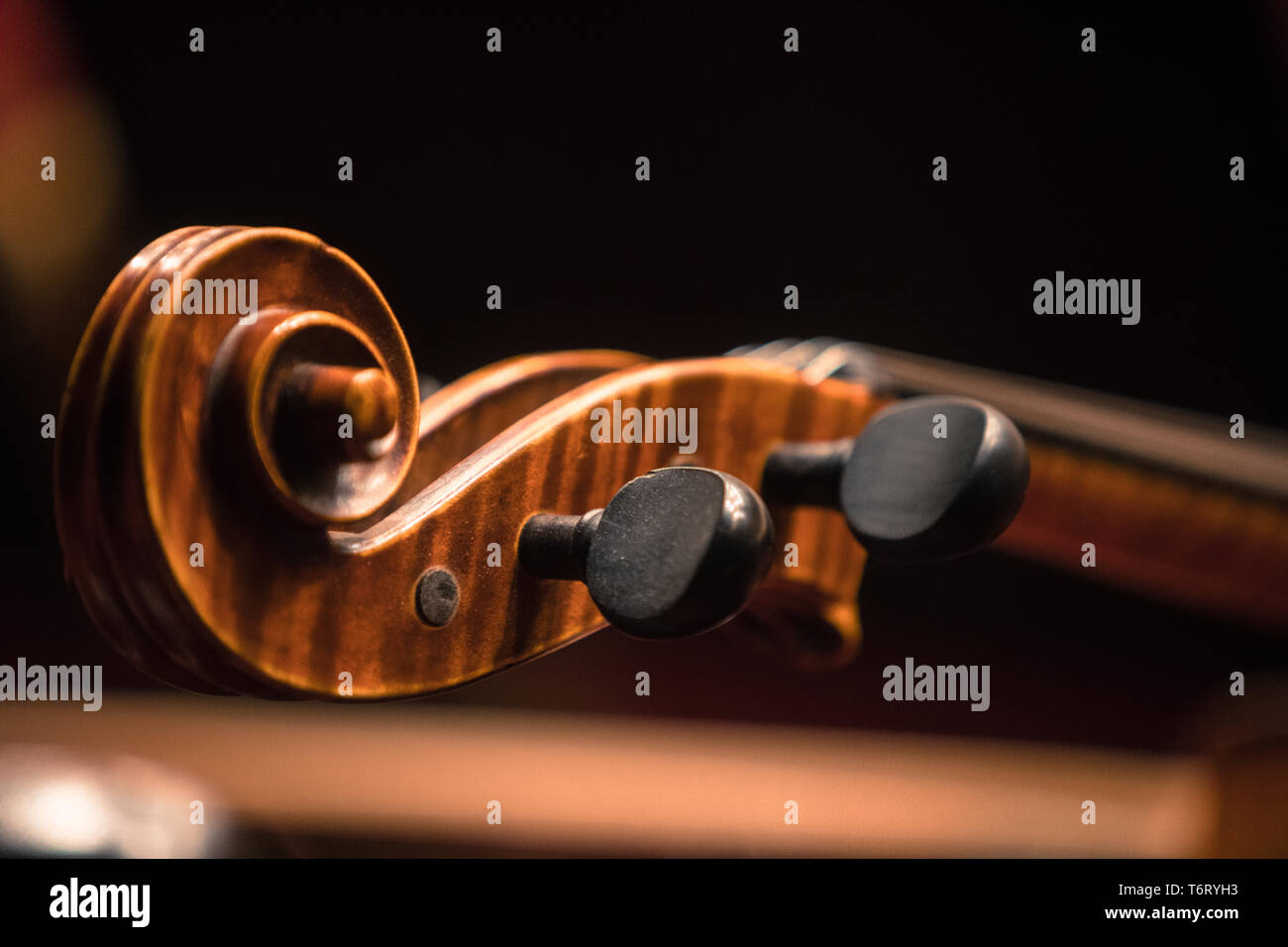 Close up shot of a double bass scroll and tuning pegs Stock Photo Alamy
