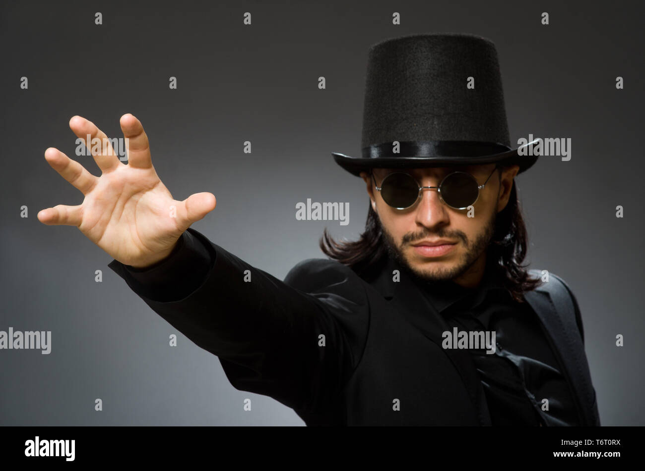 Vintage concept with man wearing black top hat Stock Photo Alamy