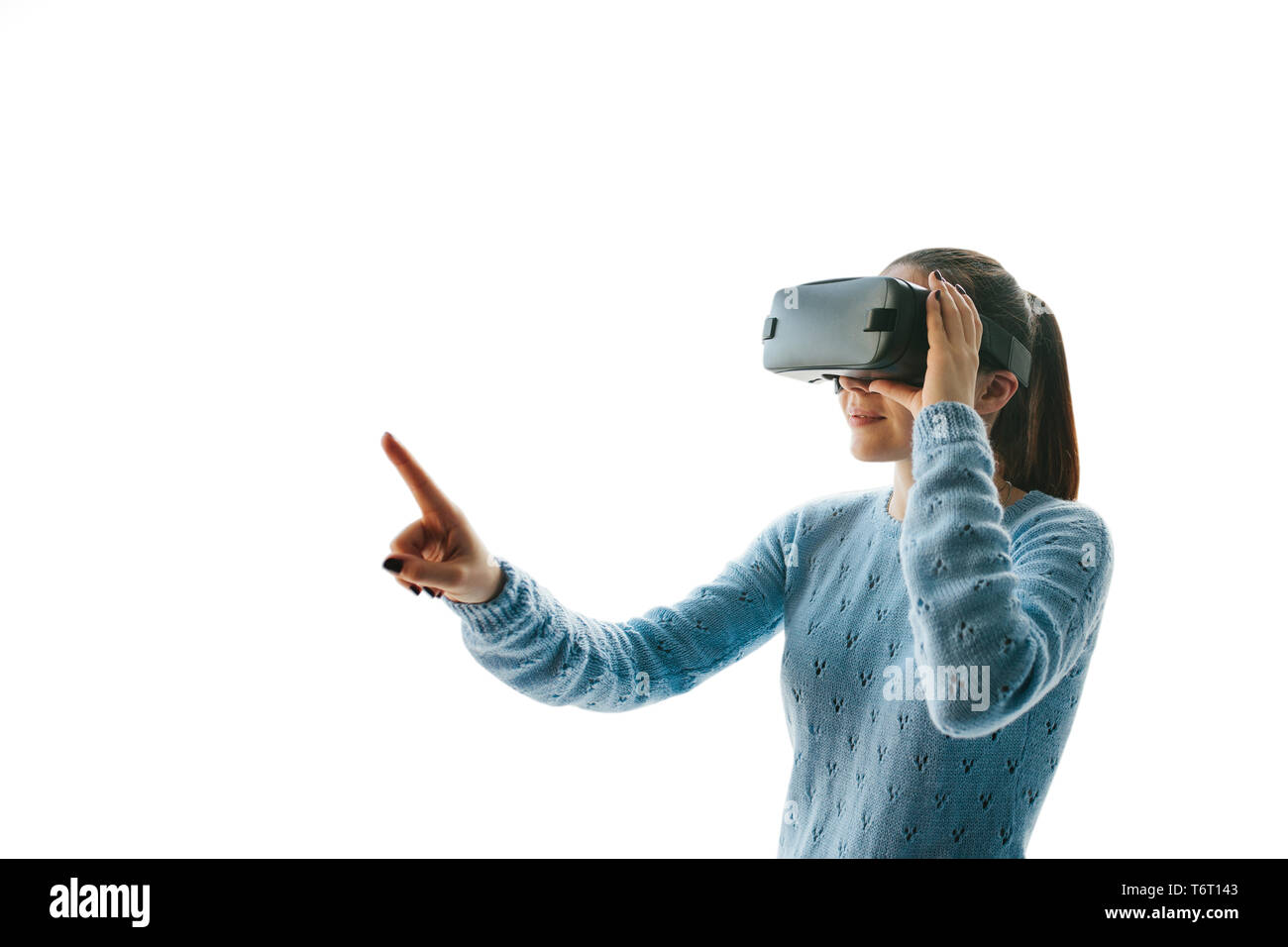 The woman with glasses of virtual reality on a white background. Future