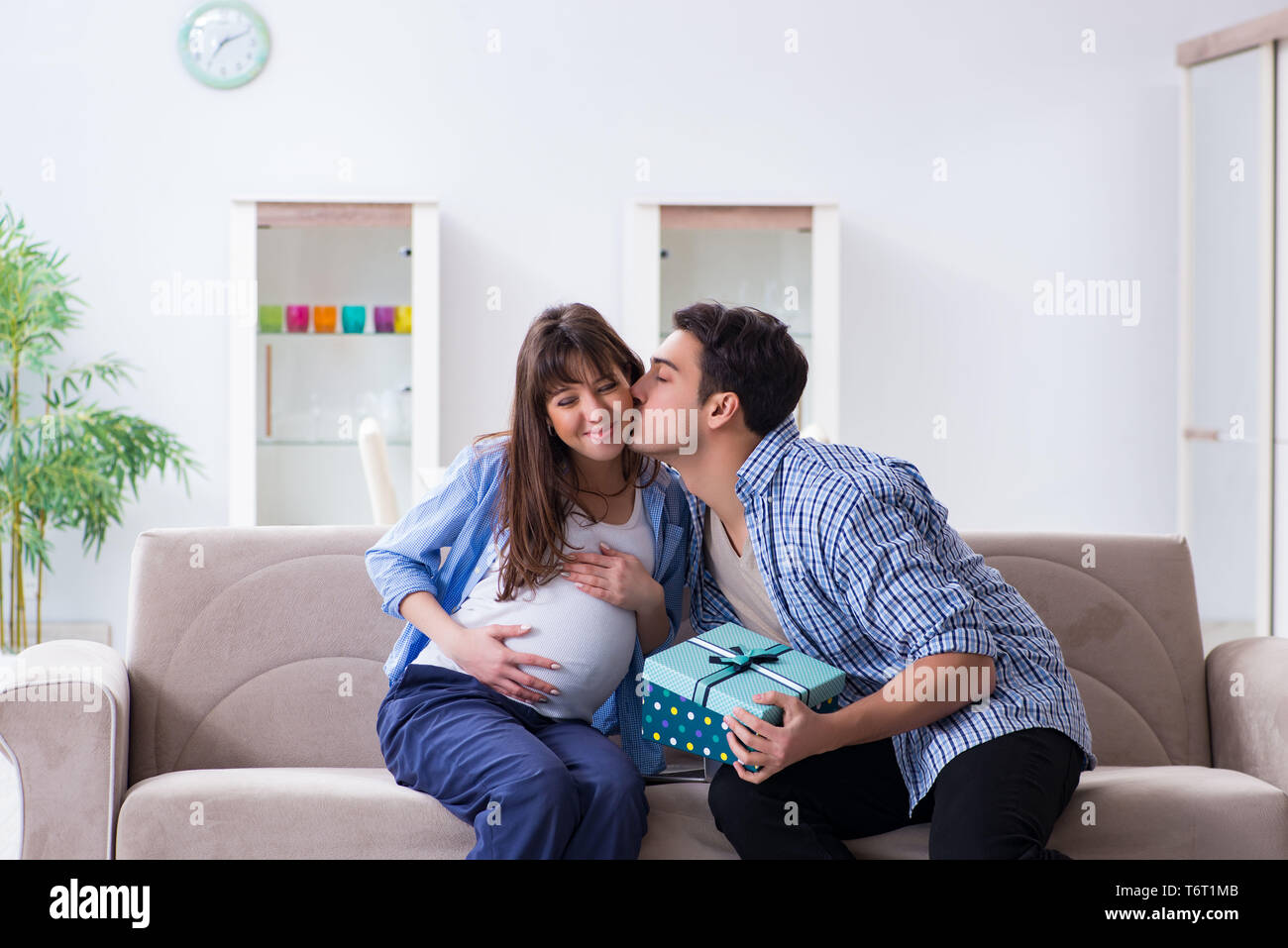 Happy family celebrating pregnancy at home Stock Photo Alamy