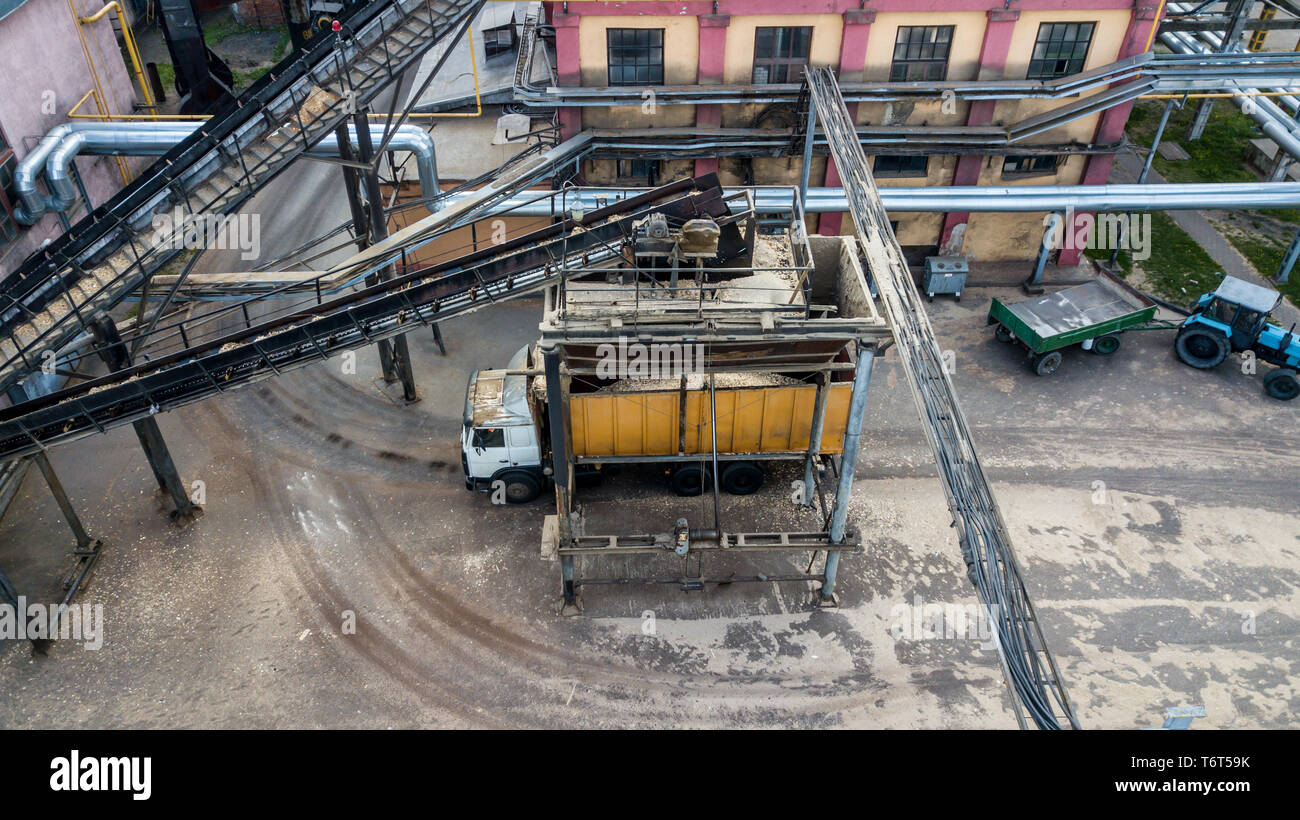 loading a truck Transporter at an industrial enterprise top view from a drone Stock Photo