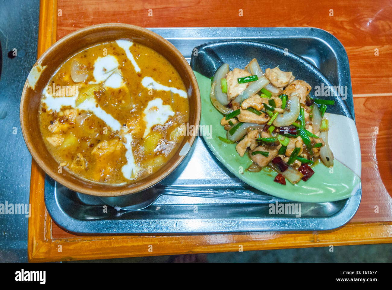 Served Massaman curry and stir fried vegetables, Thai cooking school Stock Photo
