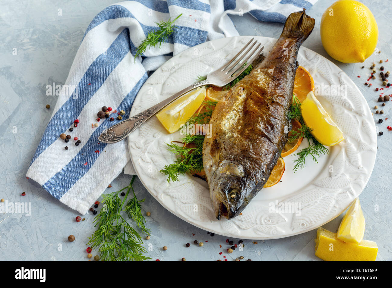 Baked lake trout with lemon and dill Stock Photo Alamy