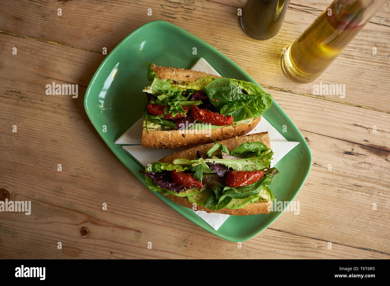 Sundried tomato sandwich on wooden table Stock Photo