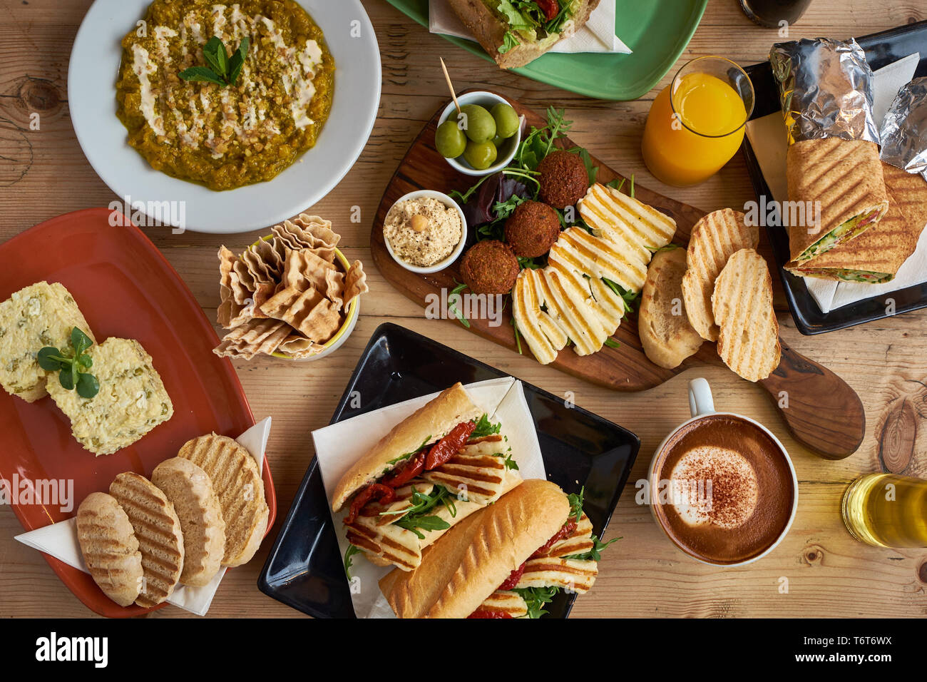 A spread of traditional Turkish food on a wooden table Stock Photo
