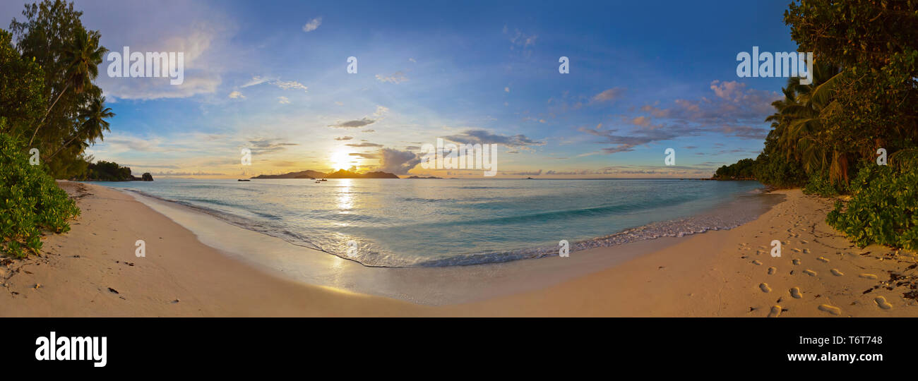 Sunset on tropical beach - Seychelles Stock Photo