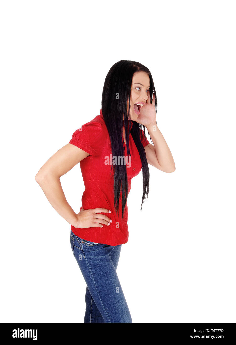 Woman in red blouse and black hair screaming Stock Photo
