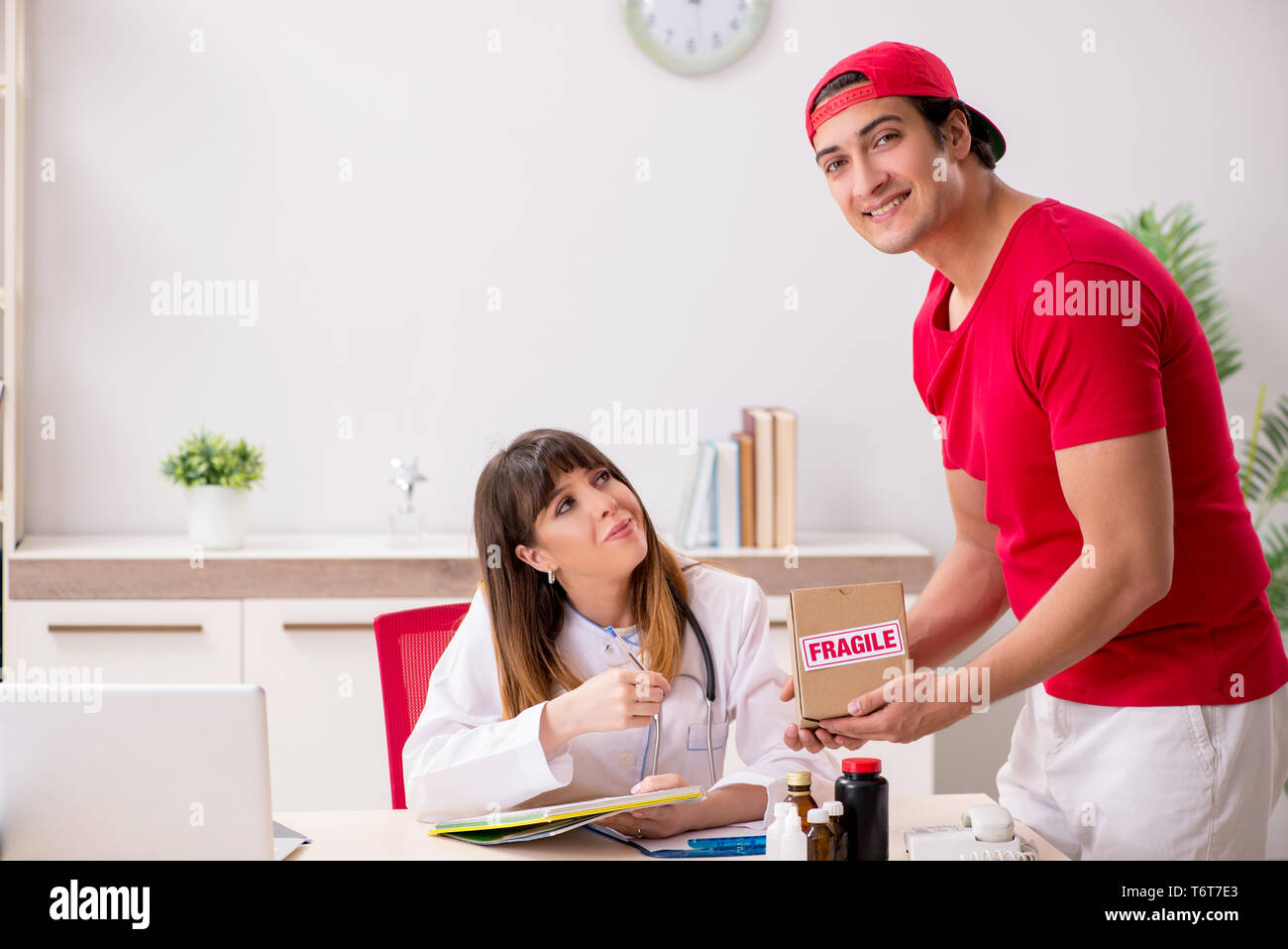 Courier delivering urgent parcel to the hospital Stock Photo Alamy