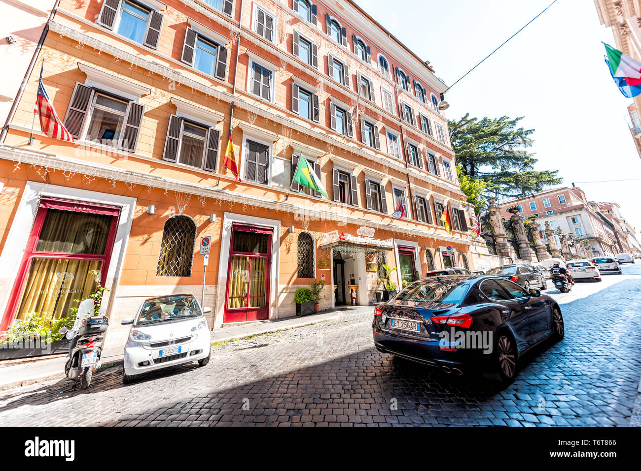 Rome, Italy - September 5, 2018: Narrow city town Via delle Quattro Fontane  street by Hotel Anglo Americano with sign and flags wide angle view Stock  Photo - Alamy, image size:1300x957