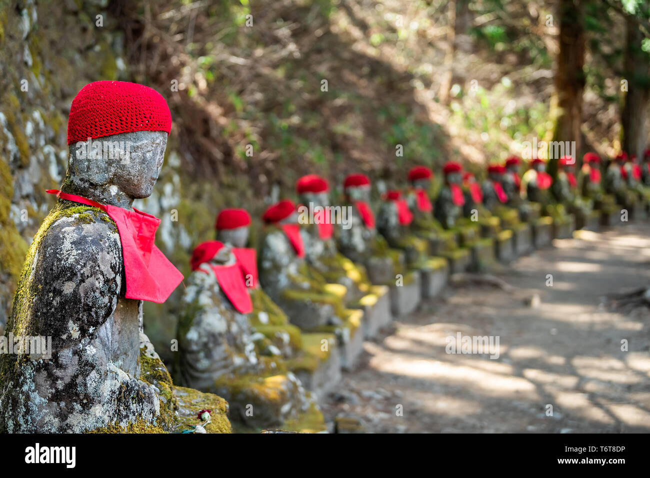 Famous stone and red Jizo statues in Kanmangafuchi Abyss, Nikko