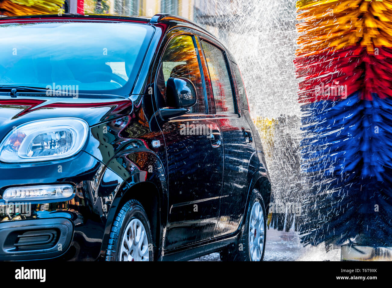 Car going through an automated car wash machine Stock Photo Alamy