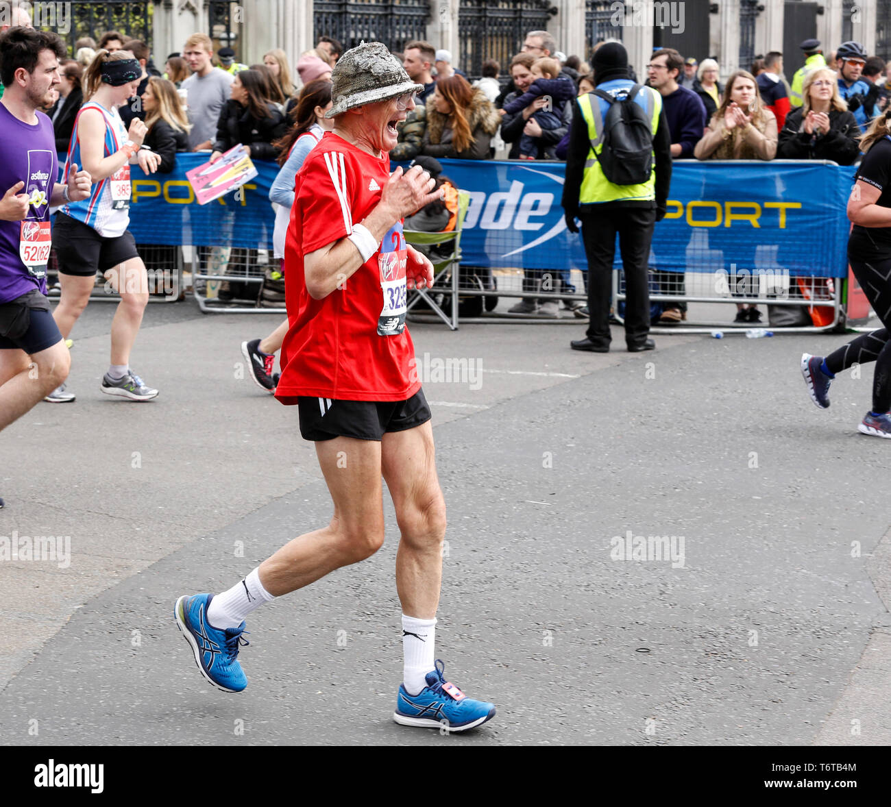 London, England – April 28, 2019: An elderly man takes the final mile of the Virgin Money London Marathon. Stock Photo