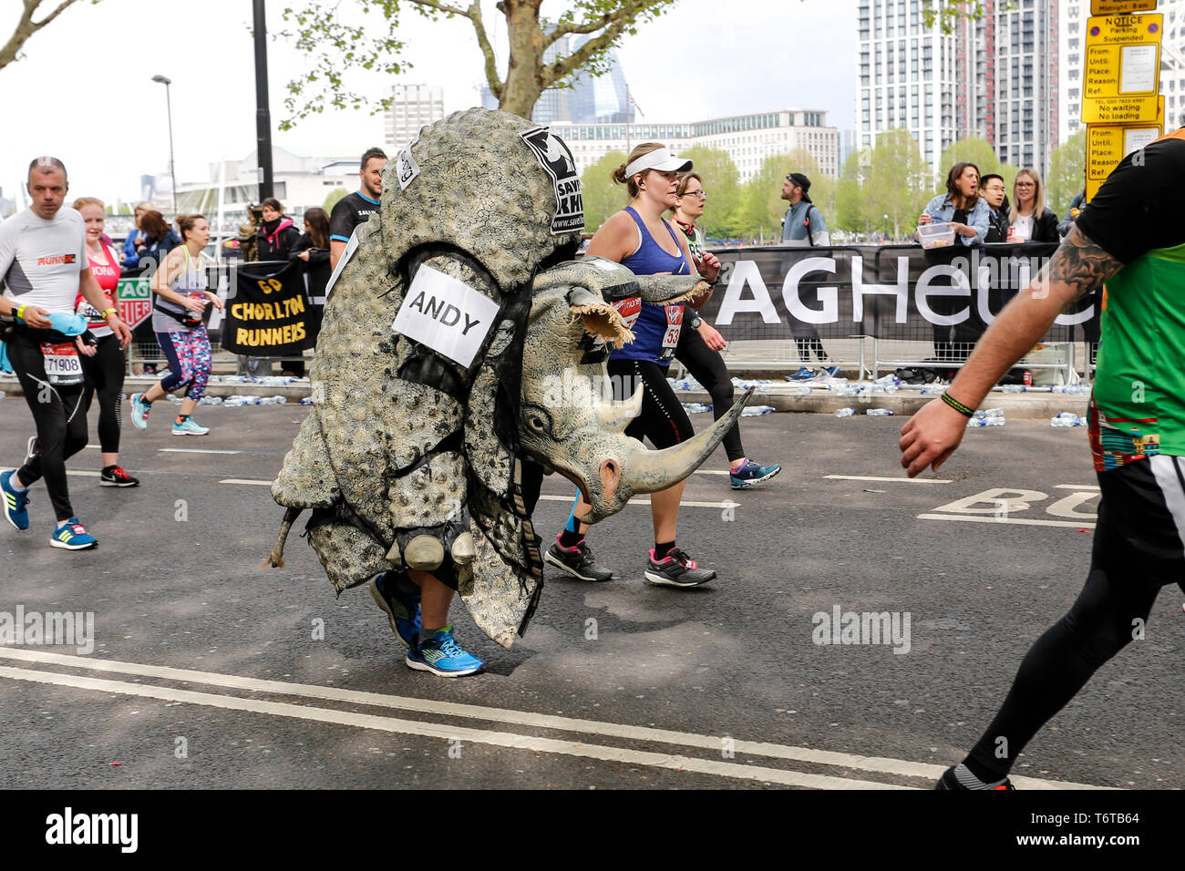 London, England – April 28, 2019: A man running as a rhino takes the final mile of the Virgin Money London Marathon. Stock Photo