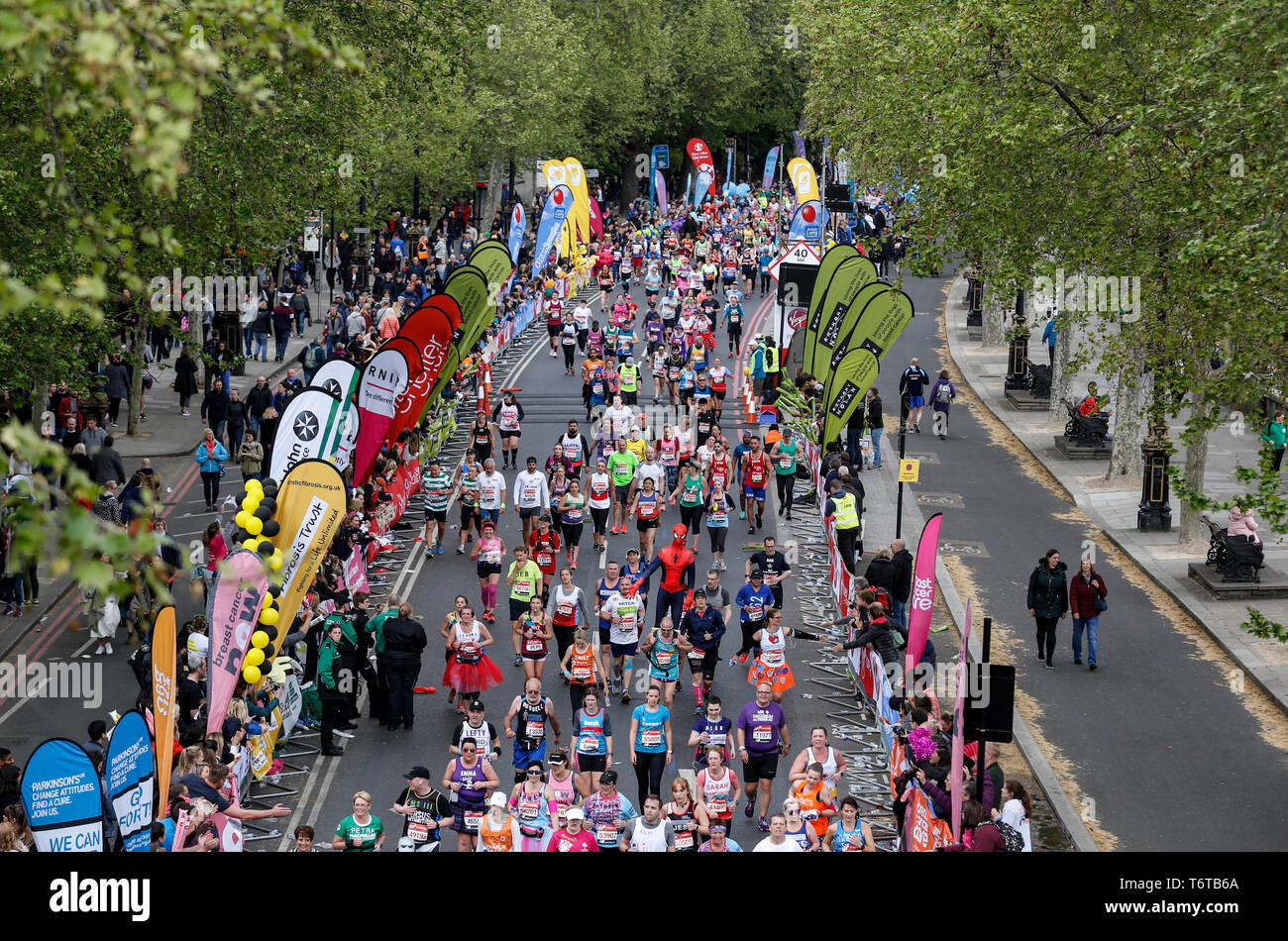 London, England – April 28, 2019: Hundreds of people take their final mile of the Virgin Money London Marathon. Stock Photo