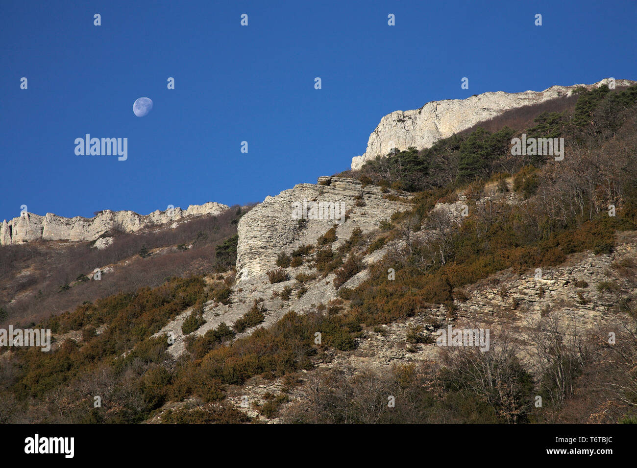 Moon above mountain ridge near the Col de Rousset Parc Naturel Regional du Vercors France Stock Photo