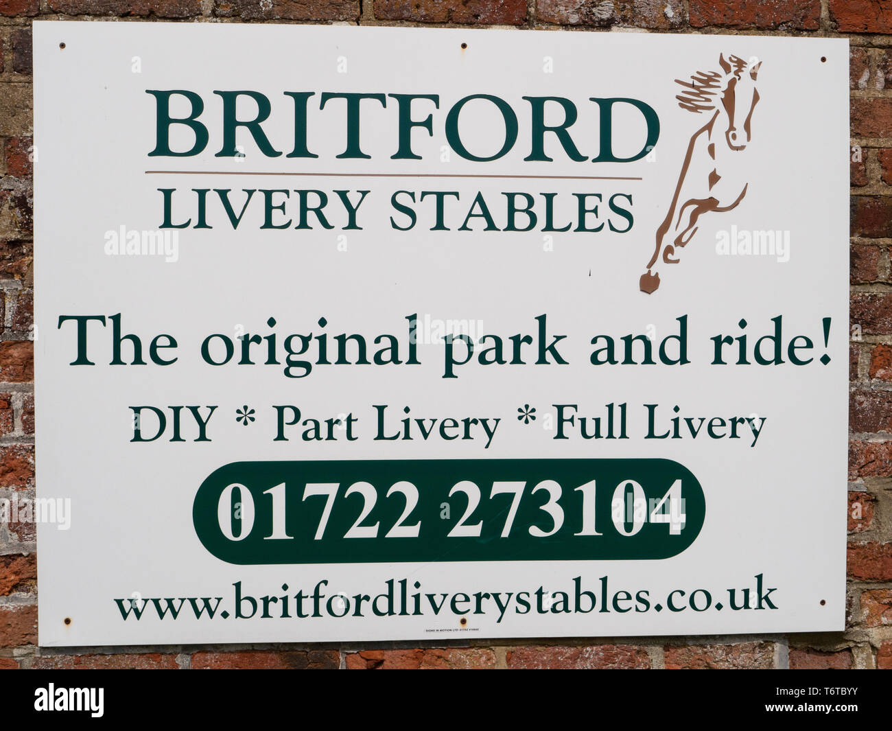 Livery sign at Britford, Wiltshire with amusing tag line. 'The original park and ride' Stock Photo