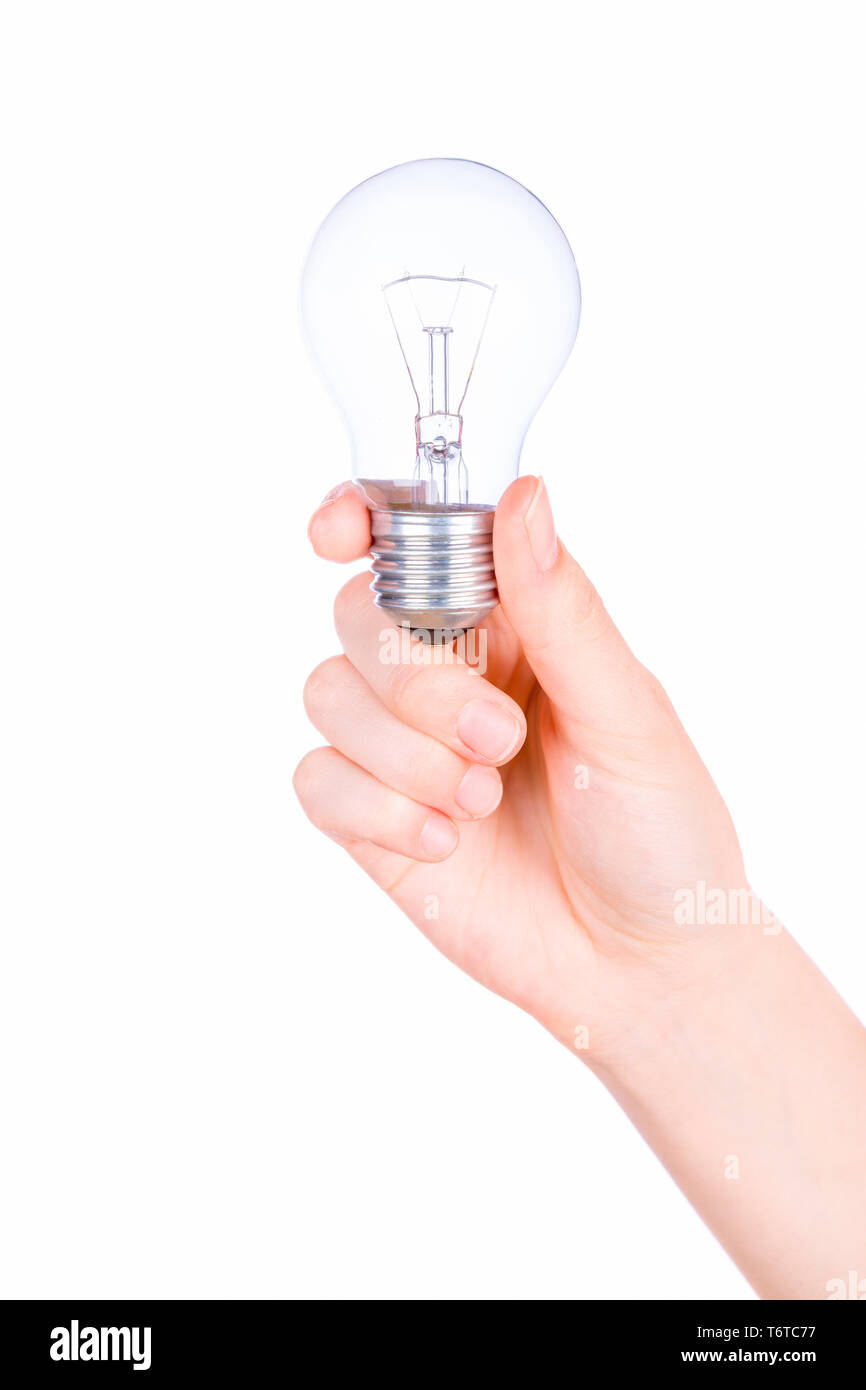 Female hand holding a light bulb on white background Stock Photo