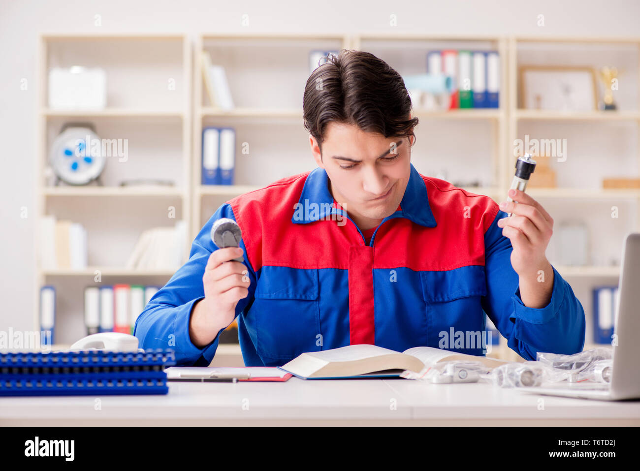 Worker in uniform working on project Stock Photo