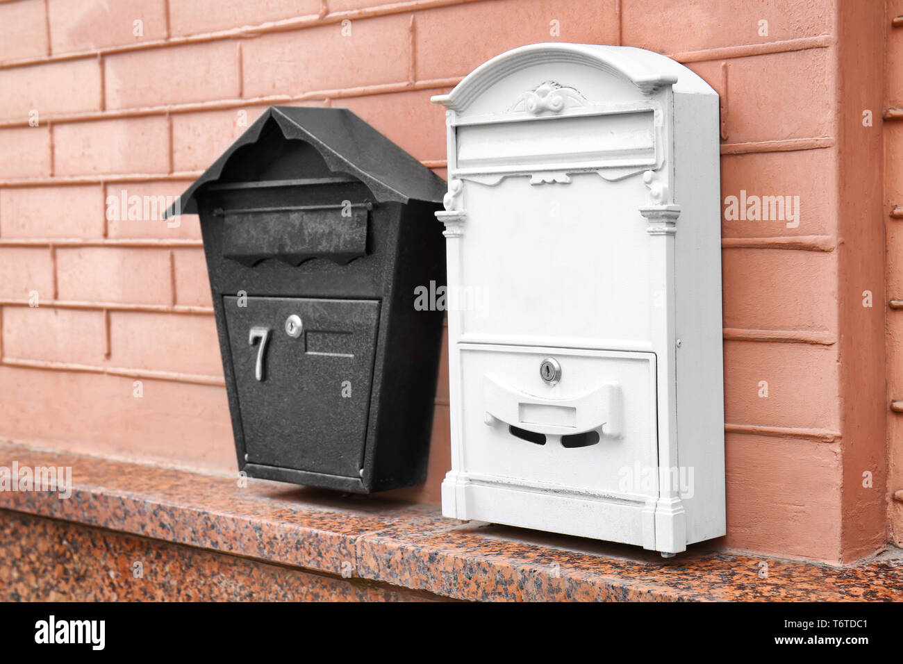 Different mailboxes on brick wall of building outdoors Stock Photo Alamy