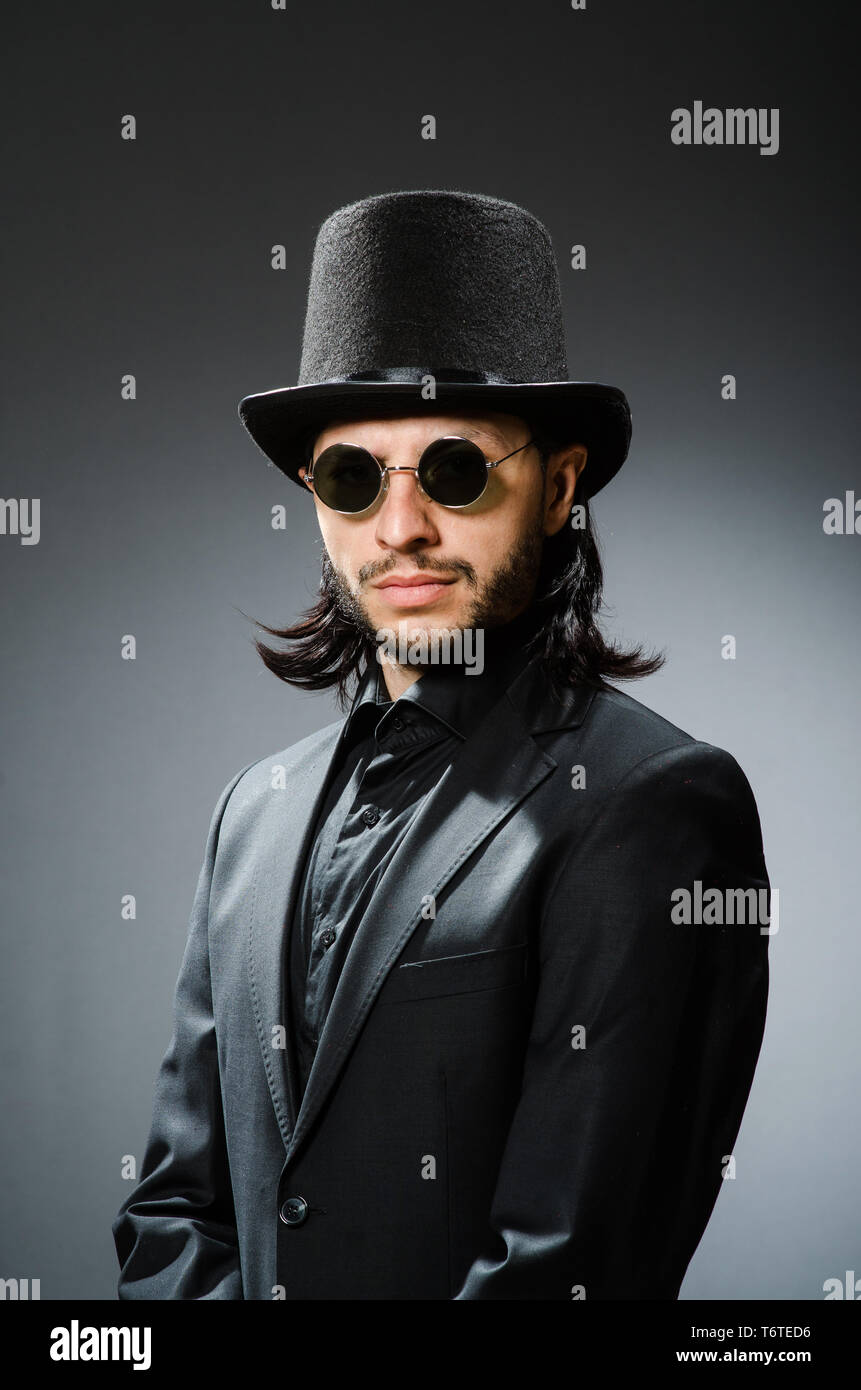 Vintage concept with man wearing black top hat Stock Photo - Alamy