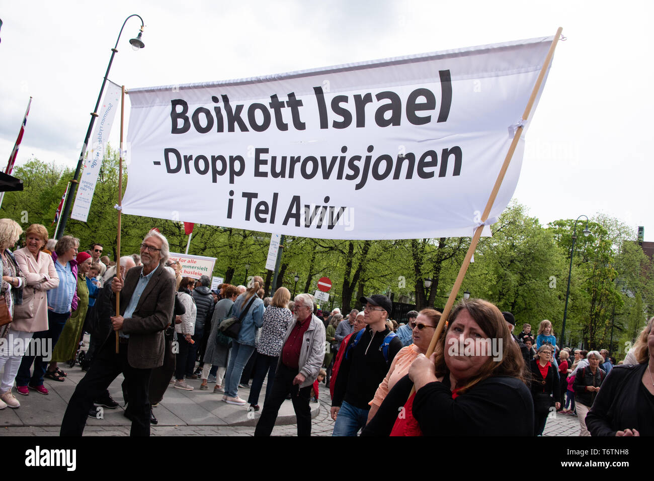 Marchers carry a banner reading 'Boycott Israel: Drop Eurovision in Tel Aviv' during a May Day march in Oslo, Norway, May 1, 2018. Stock Photo