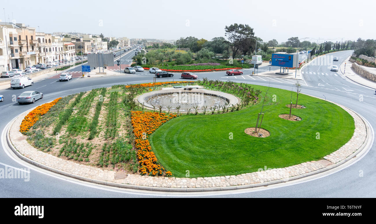 Flowers arrangement and roundabouts in Malta and Gozo Stock Photo Alamy