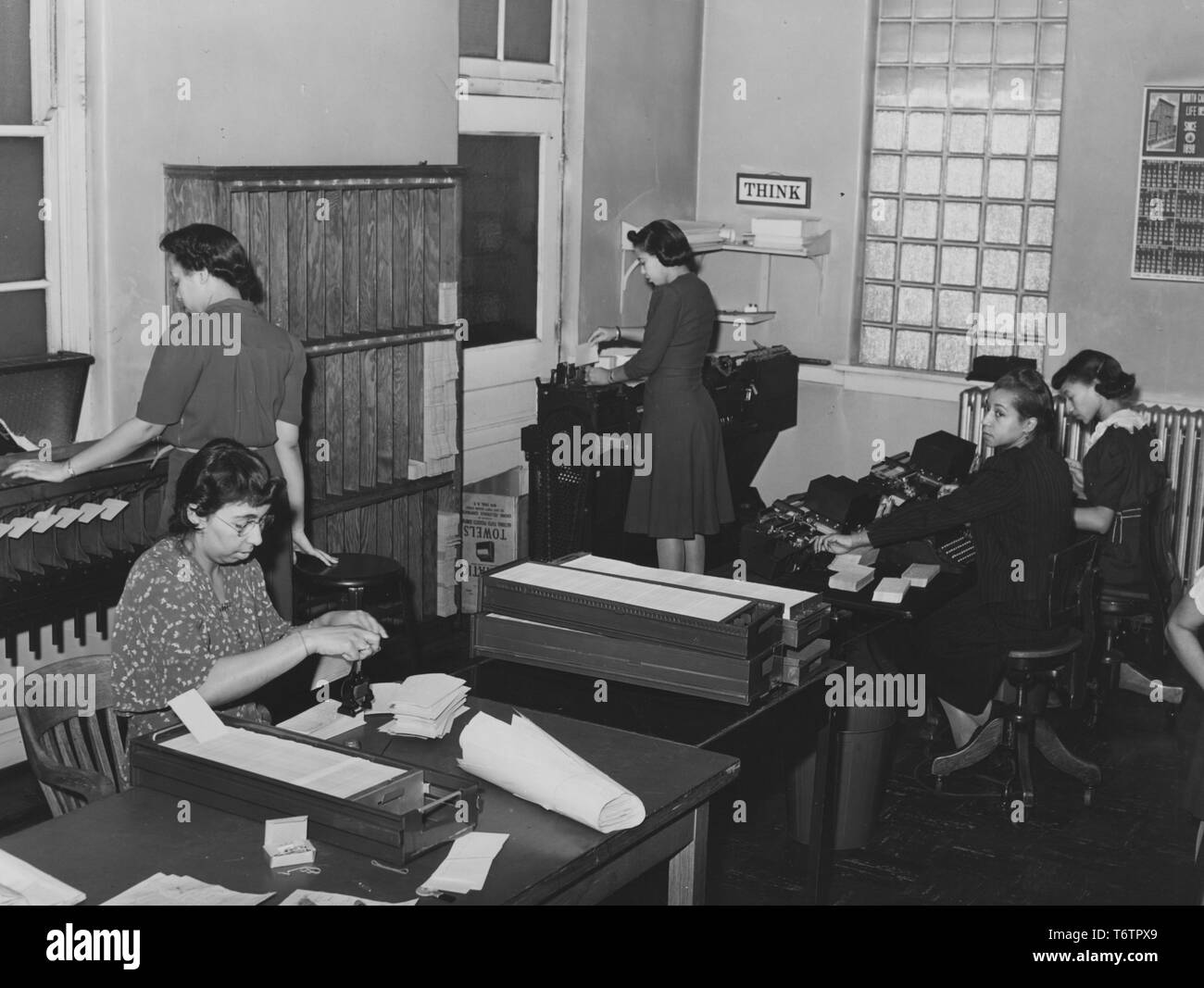 Photograph of an african american women clerks hi-res stock photography ...