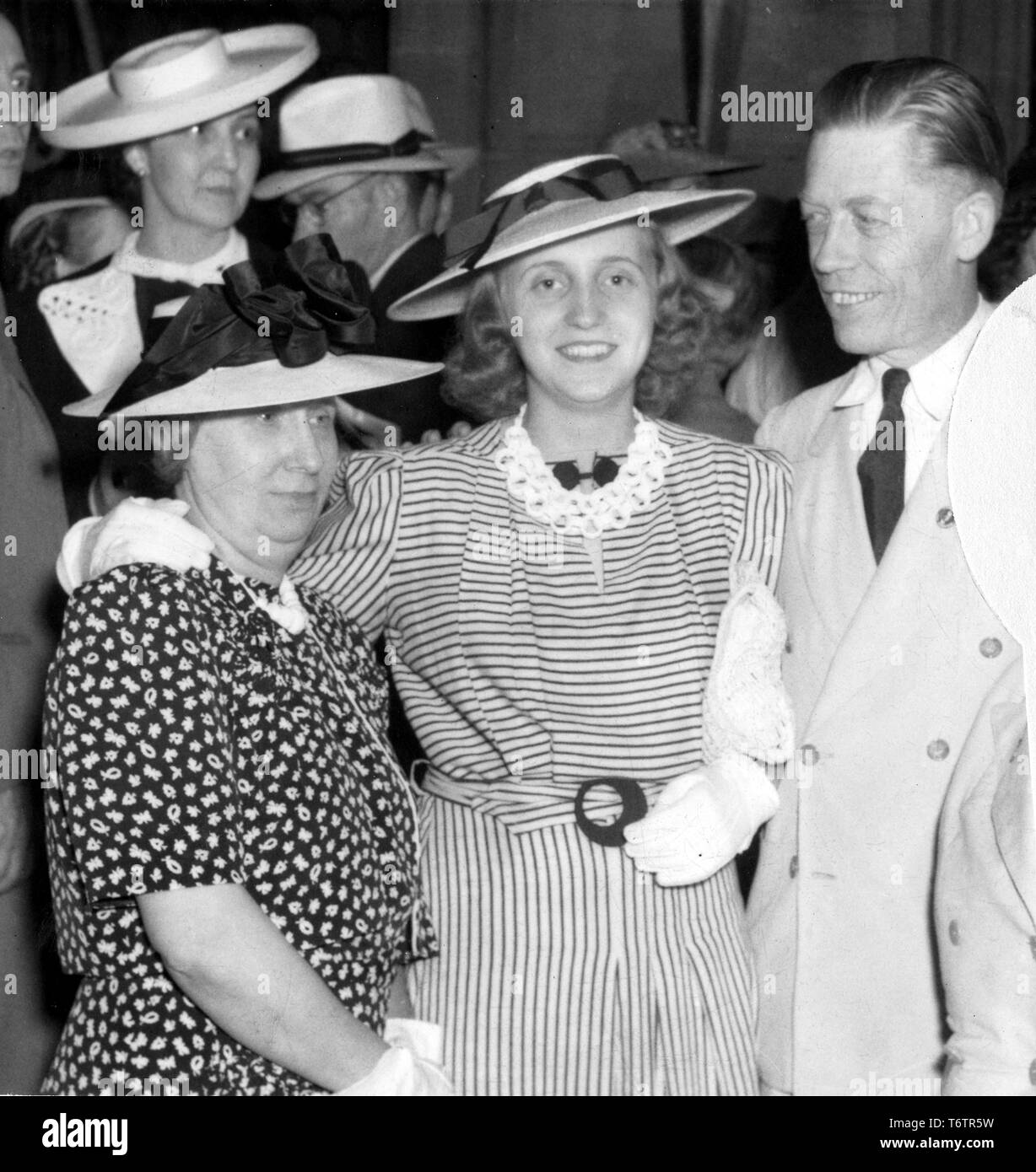 First Lady Bess Truman, her daughter Margaret Truman, and campaign manager Victor Messall, from the waist up, posing together at a 1940 reelection campaign rally for President Harry Truman, Sedalia, Missouri, 1940. Image courtesy National Archives. () Stock Photo