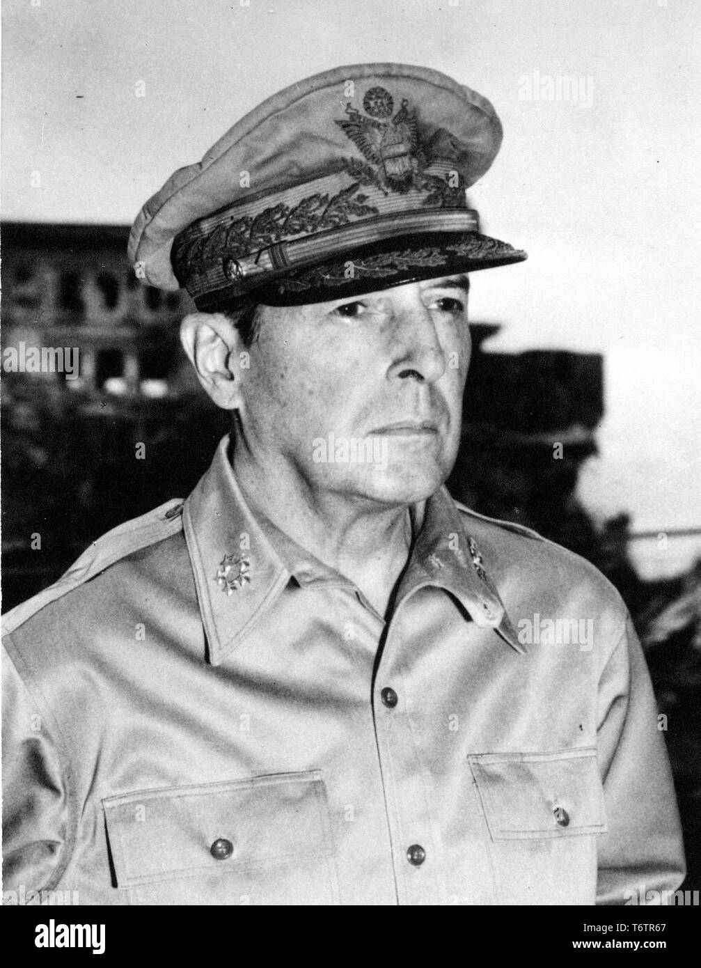 Close-up, from the chest up, of General Douglas MacArthur wearing his Field Marshal of the Philippines uniform and cap and a serious expression on his face, 1945. Image courtesy National Archives. () Stock Photo