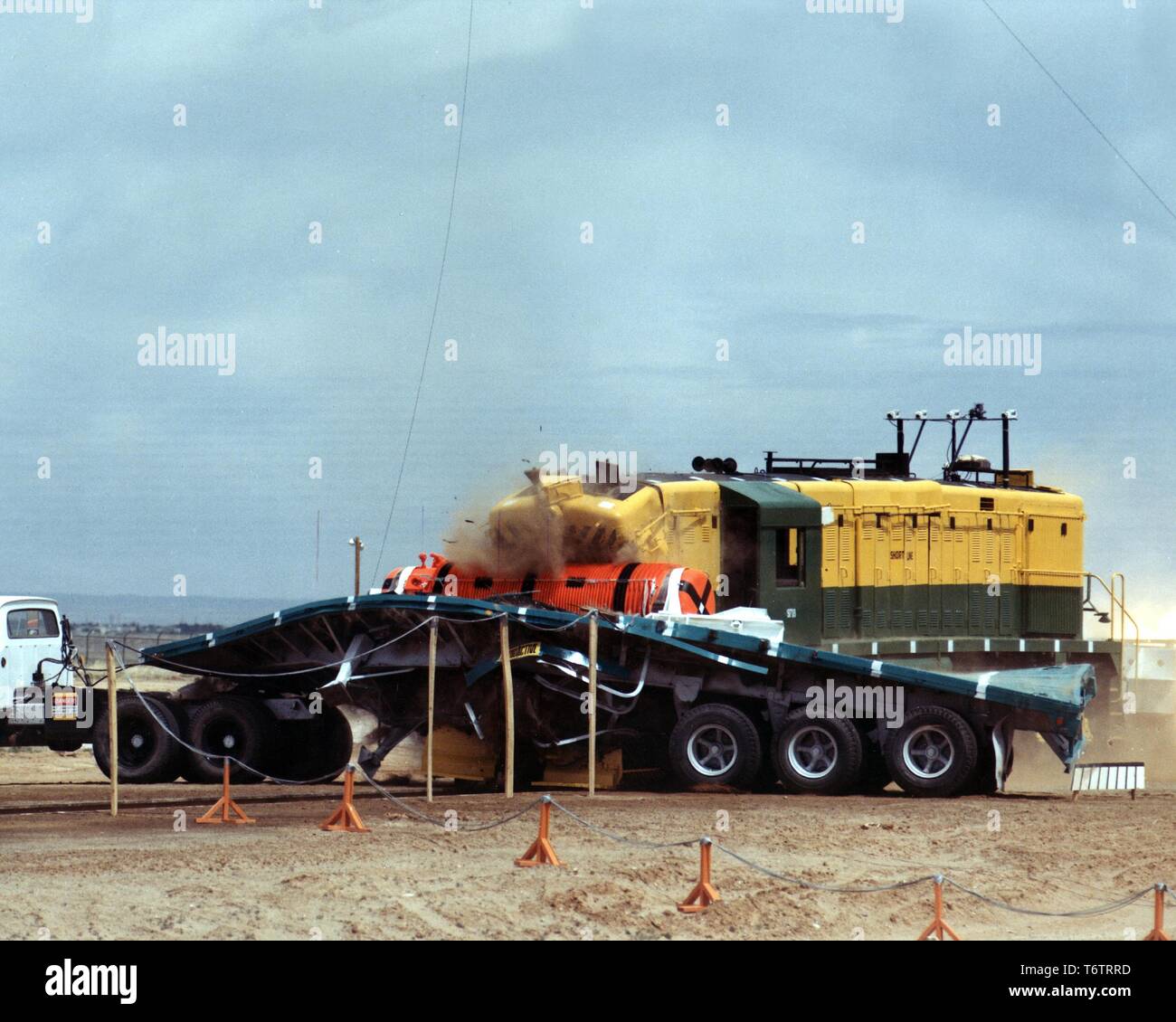 A train hitting a flatbed truck carrying a spent nuclear fuel cask during an 82 mile per hour grade-crossing test, Albuquerque, New Mexico, 1978. Image courtesy US Department of Energy. () Stock Photo