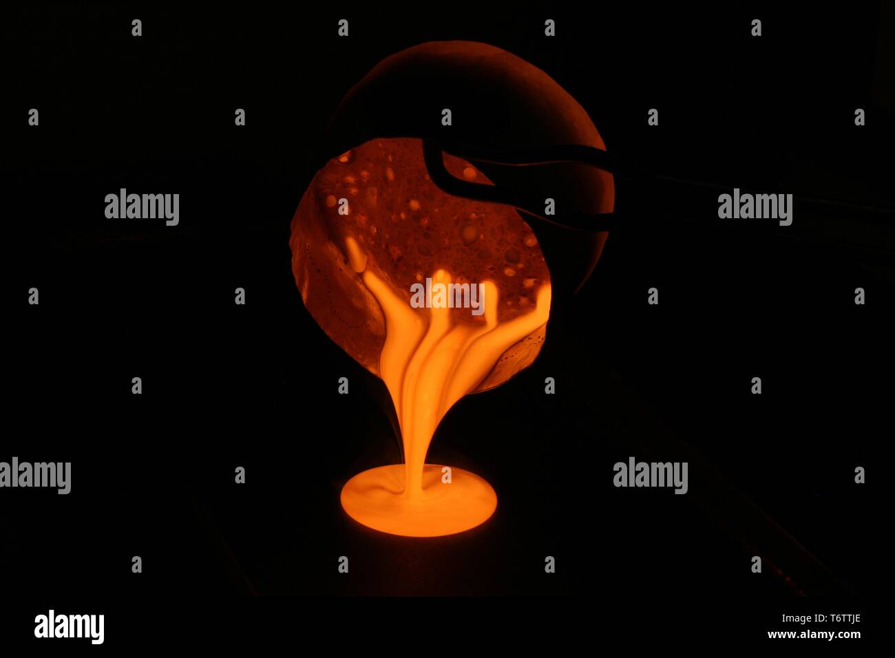 Nuclear waste being poured out during vitrification experiments at Pacific Northwest National Laboratory, Richland, Washington, 2013. Image courtesy US Department of Energy. () Stock Photo