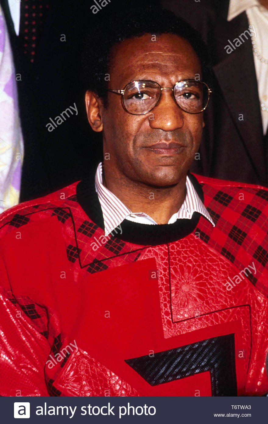 a-color-photo-of-a-close-up-of-bill-cosby-looking-at-the-camera-and-wearing-a-red-plaid-sweater-about-to-receive-the-medgar-evers-award-on-2-28-1986-credit-2096037globe-photosmediapunch-T6TWA3.jpg