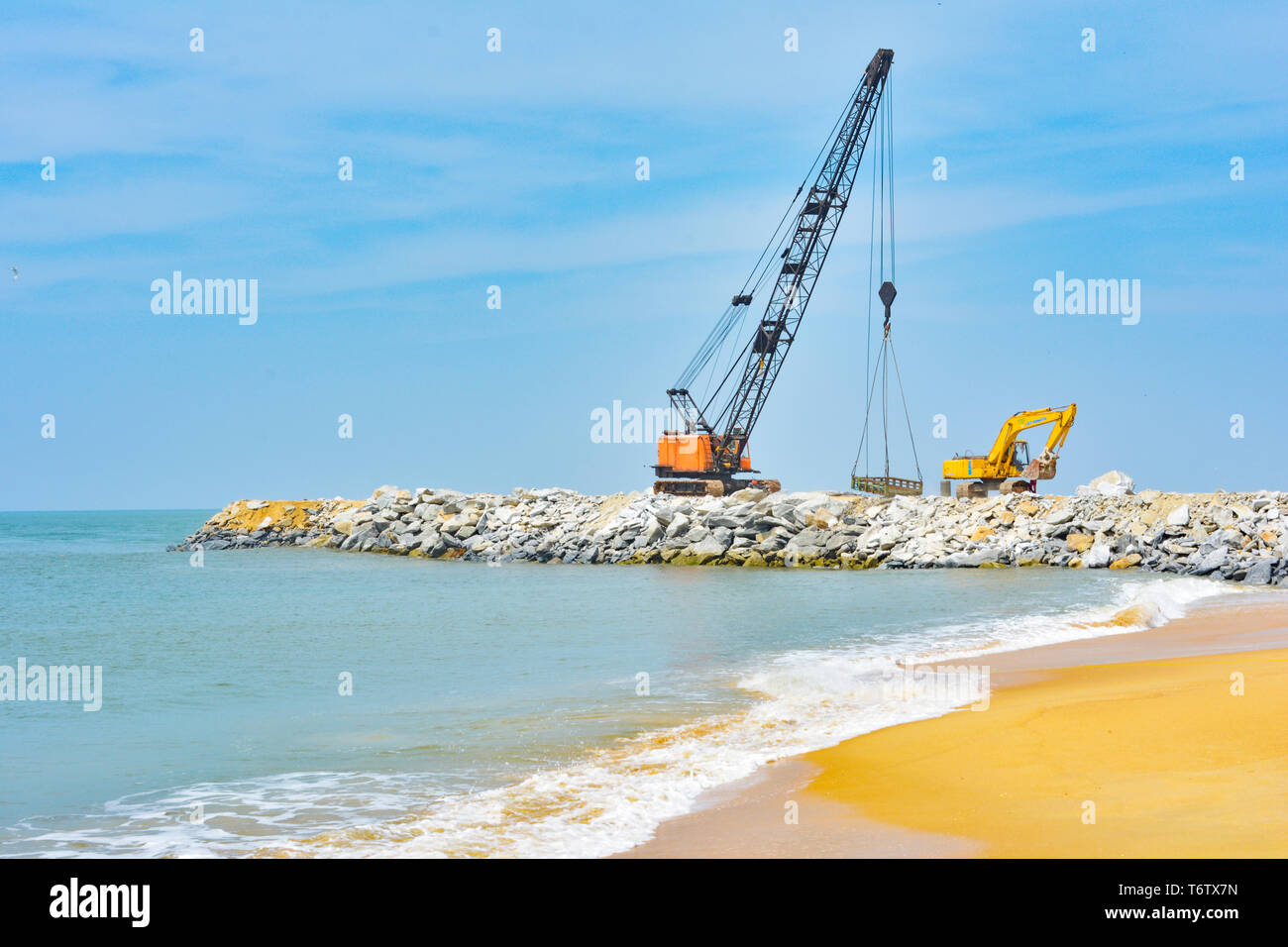 Udupi, India - NOVEMBER 11 2017: Industrial crane working in the coastal area Stock Photo