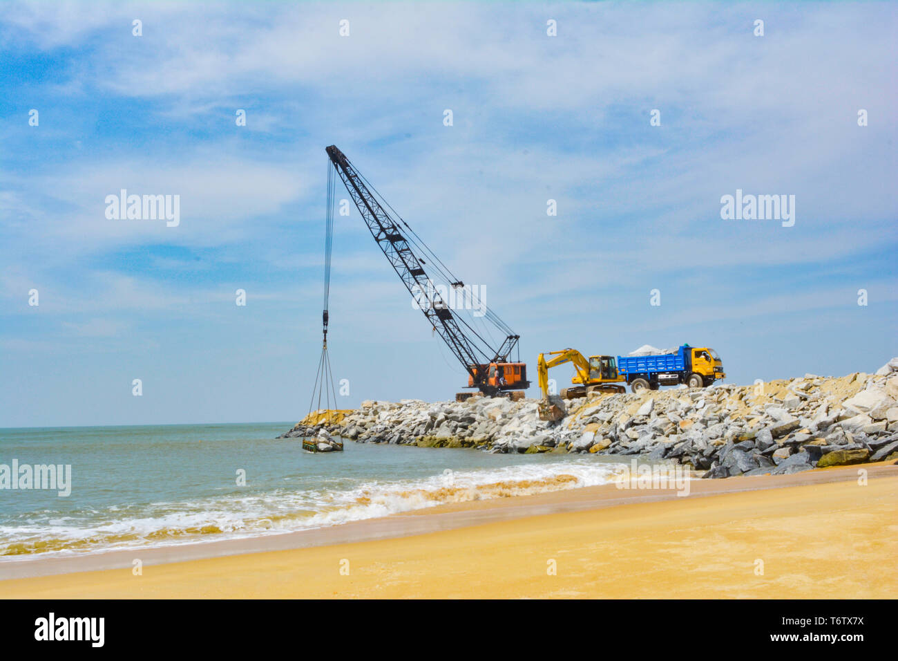 Udupi, India - NOVEMBER 11 2017: Industrial crane working in the coastal area Stock Photo
