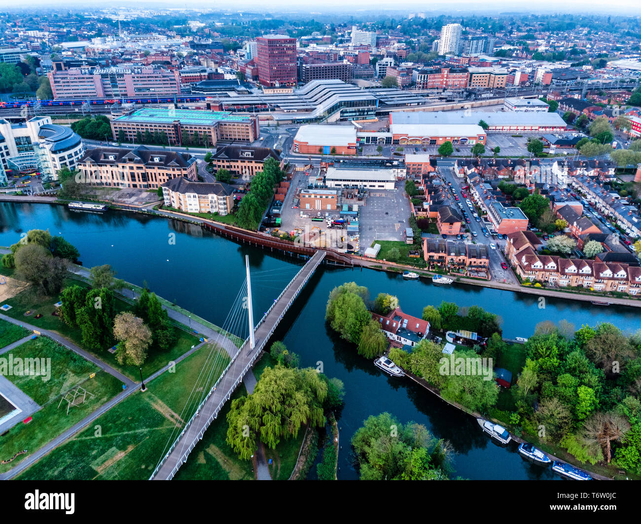 Aerial photograph of Reading, Berkshire, UK, taken at sunrise, including the River Thames. Showing Christchurch Bridge and Reading Station Stock Photo