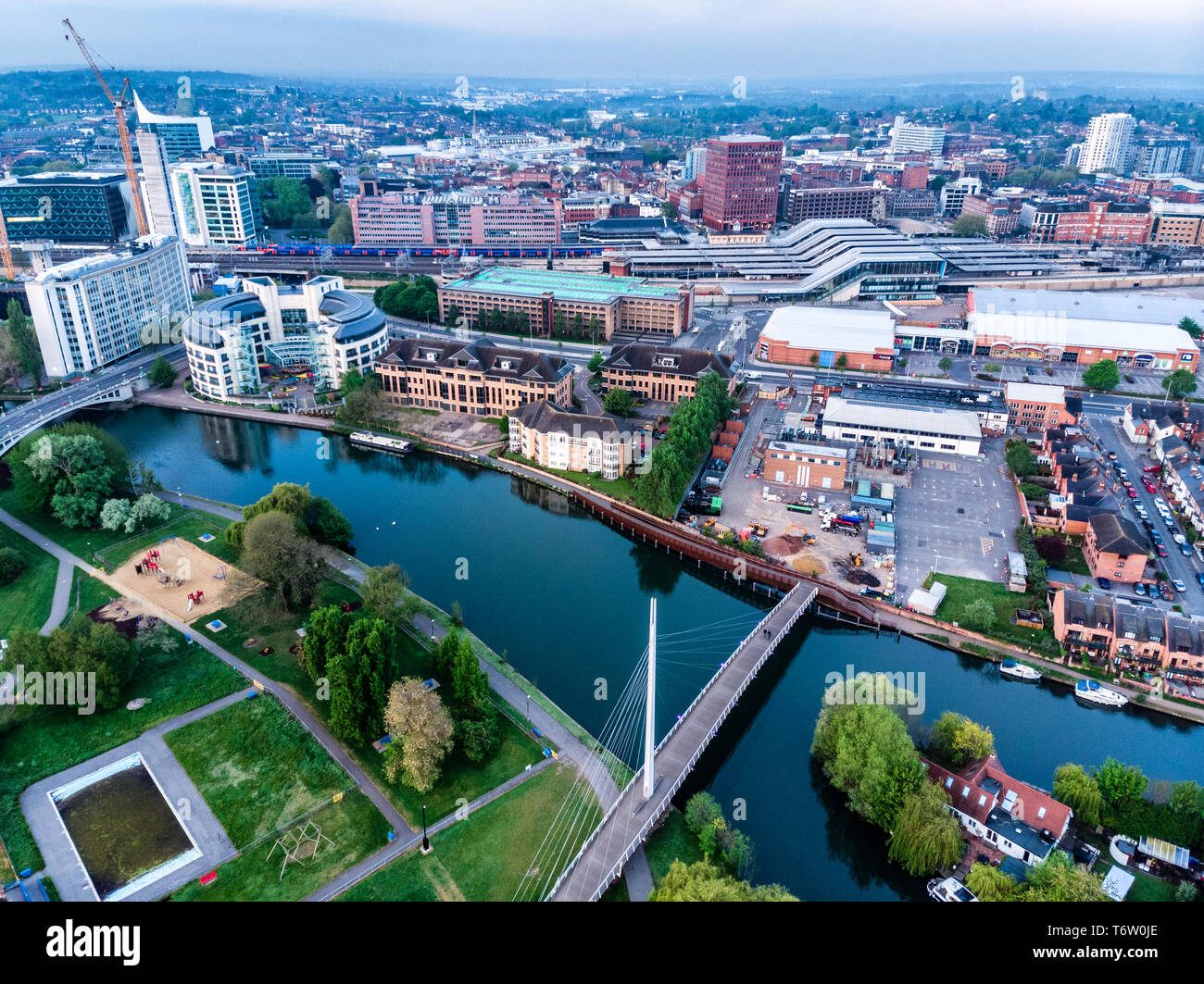 Aerial photograph of Reading, Berkshire, UK, taken at sunrise, including the River Thames. Looking East showing Reading and Christchurch footbridge Stock Photo