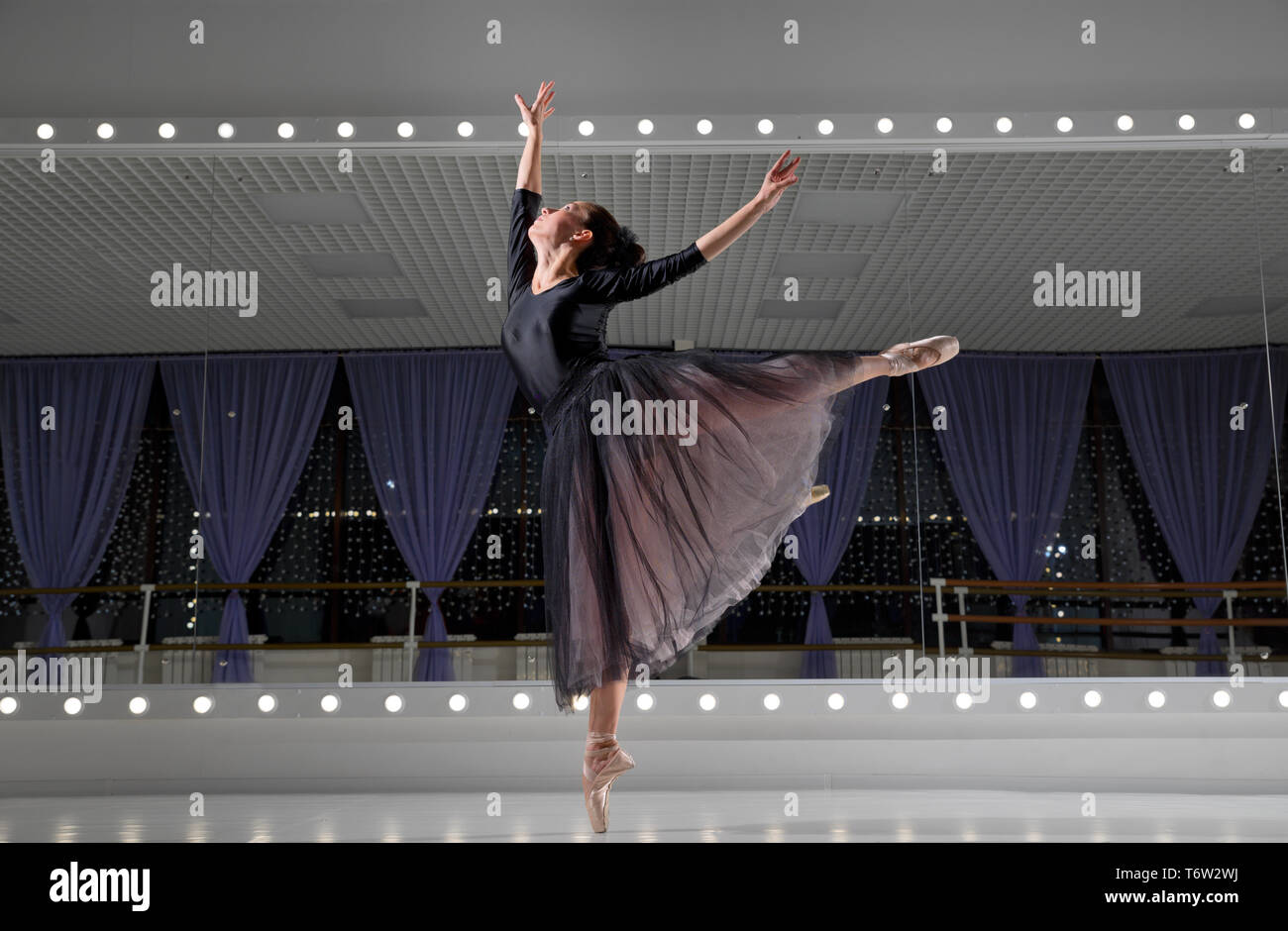 Young ballerina in training hall Stock Photo