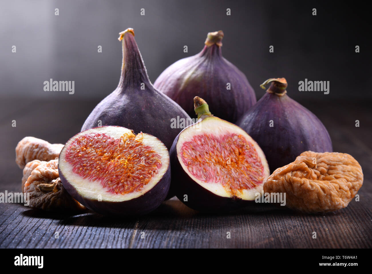 Composition with fresh and dried figs on wooden table. Stock Photo