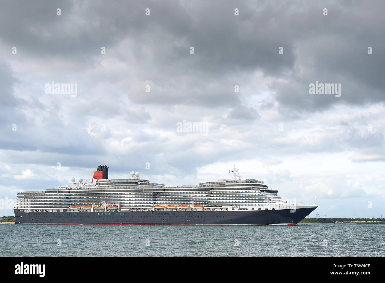 The Giant, Cunard Line, Cruise Ship, MS QUEEN VICTORIA, Passing Calshot Spit, As She Sails Out Of Southampton, UK, For Hamburg, Germany. 28 April 2019 Stock Photo