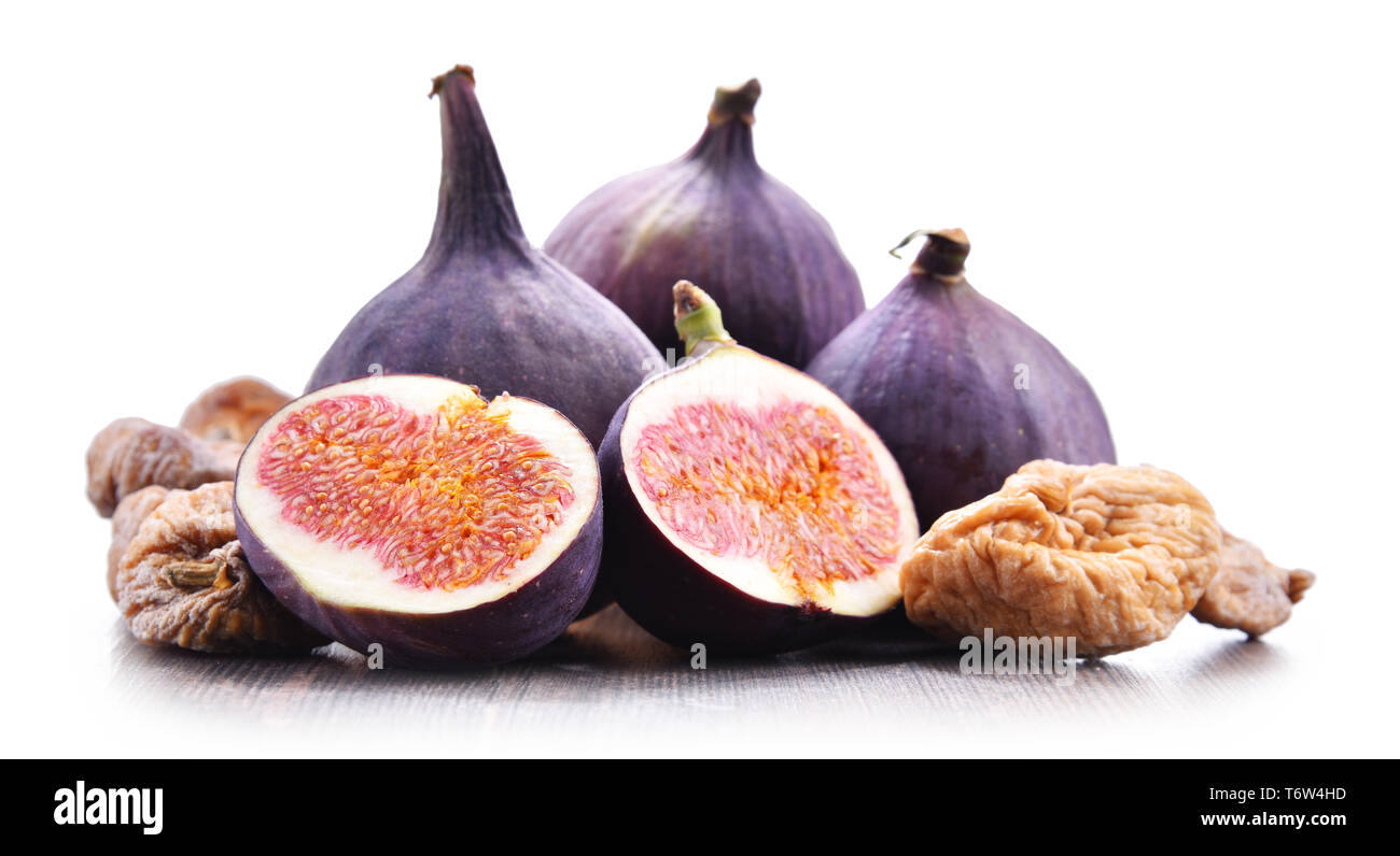 Composition with fresh and dried figs isolated on white. Stock Photo