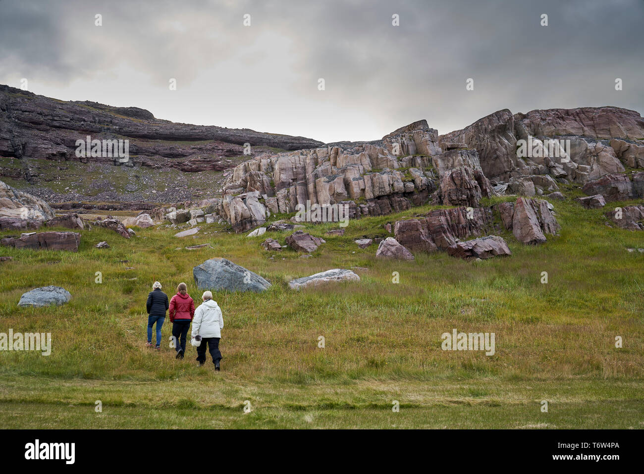 Tourists at Igaliku ancient Norse ruins at Gardar, South Greenland Stock Photo