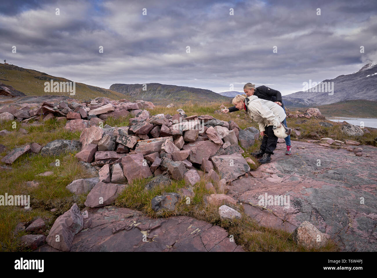 Tourists at Igaliku ancient Norse ruins at Gardar, South Greenland Stock Photo