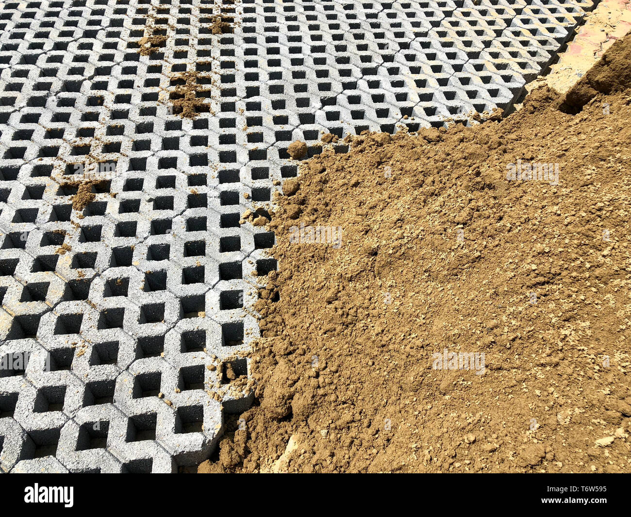 gray color stone brick block floor tile with green grass and sand as ...