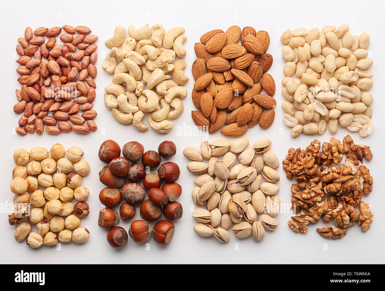 Composition with different types of nuts on white background Stock