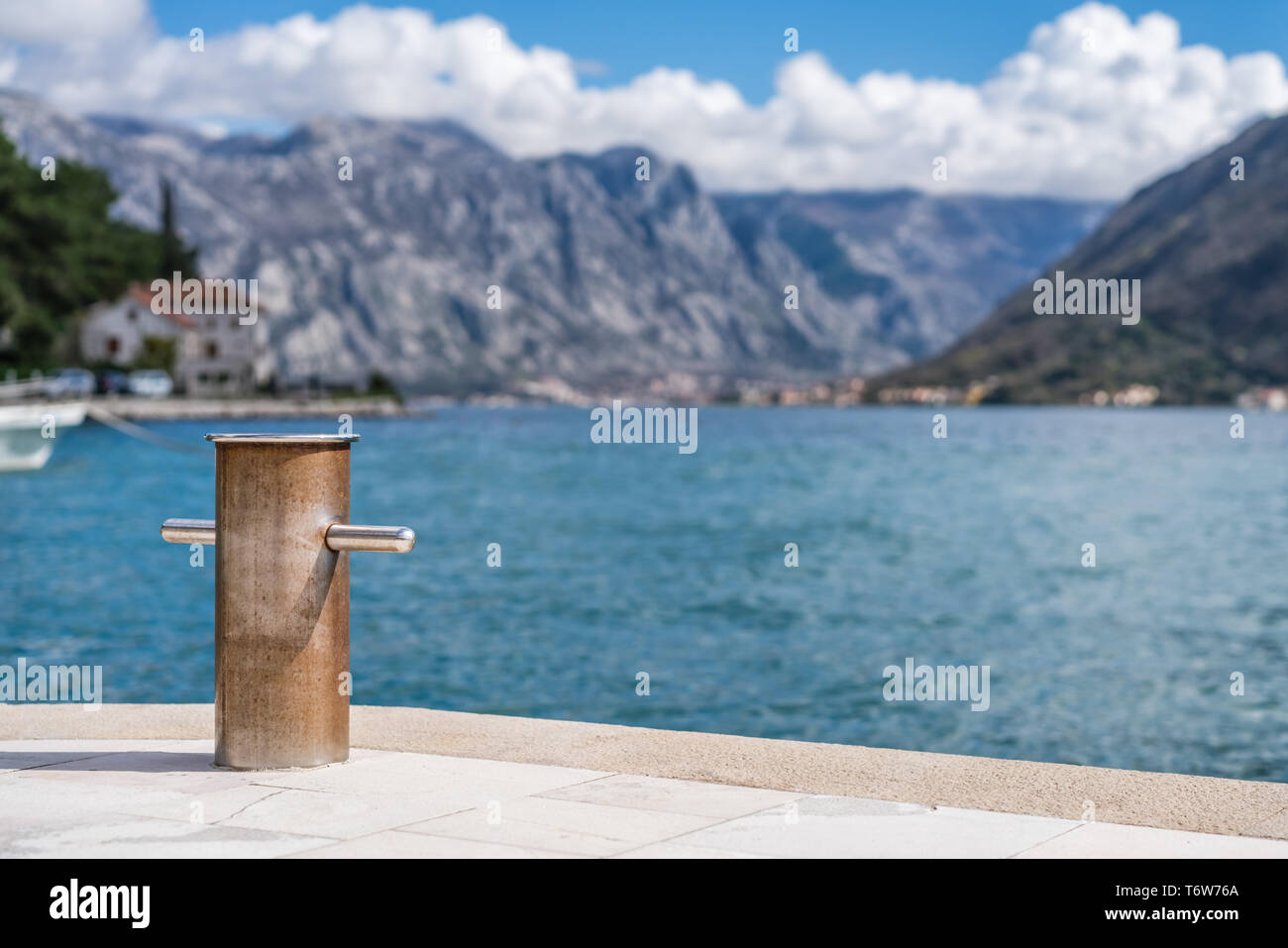 Steel anchoring bollard on the shore Stock Photo